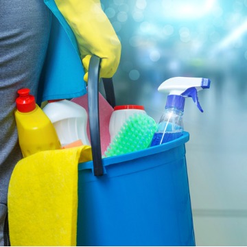 Maintenance Worker holding bucket of cleaning supplies for commercial cleaning in Peoria IL