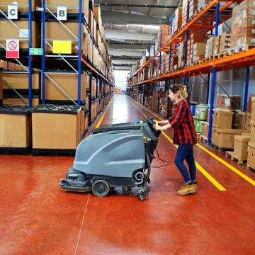 Woman floor waxing, as part of Commercial Cleaning Services in East Peoria IL