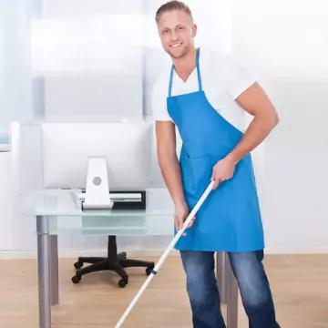 A worker is seen cleaning an office floor. Corporate Clean is an Office Cleaning Company.