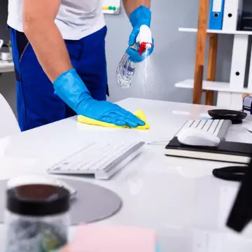 A cleaner is seen cleaning an office. The best office cleaning in Peoria County IL is done by Corporate Clean.