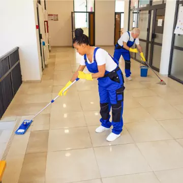Cleaners are seen at work. Corporate Clean is the best of the professional Cleaning Companies in East Peoria IL.