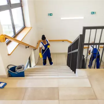 Workers are seen cleaning a stairwell. Corporate Clean offers Commercial Cleaning in Dunlap IL