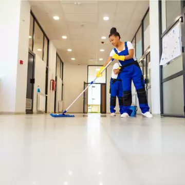 Cleaners are seen at work. Corporate Clean performs business cleaning in Washington IL.