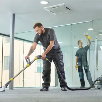 Cleaners are seen at work. Corporate Clean performs business cleaning in Morton IL.