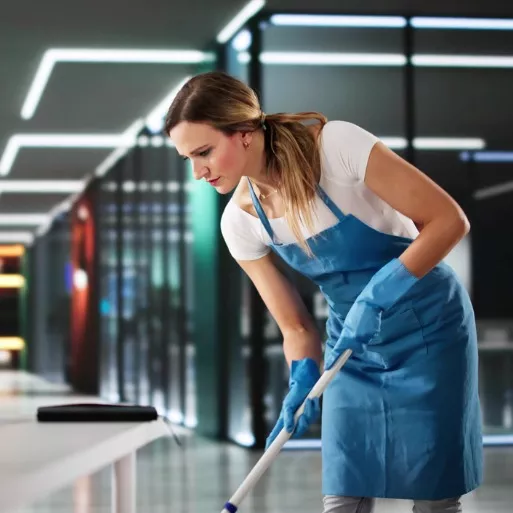 A professional cleaner focused on cleaning the floors of a large office complex in Peoria, IL
