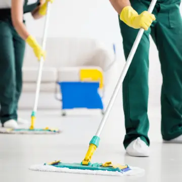 Members of Corporate Clean scrub floors, which is a key trait to look for when you're Hiring a Commercial Cleaning Company