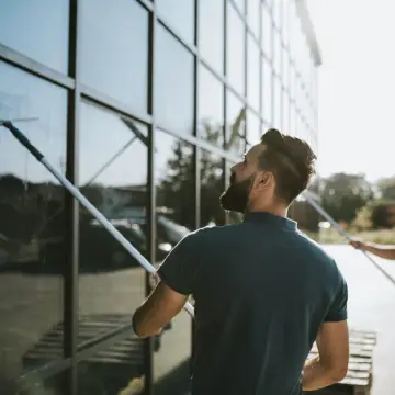 A member of Corporate Clean cleans windows, which is a key trait to look for when you're Hiring a Commercial Cleaning Company